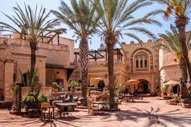 Courtyard with palm trees and traditional Moroccan architecture in Essaouira